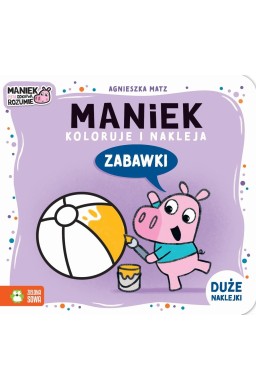 Maniek koloruje i nakleja. Zabawki